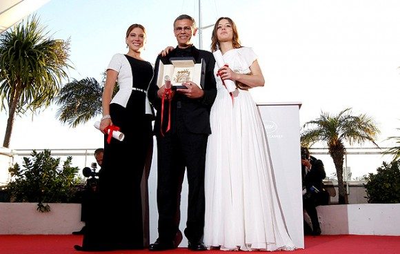 From left to right: actress Lea Seydoux, director Abdellatif Kechiche, and actress Adele Exachopoulos. Kechiche is holding the Palme d'Or